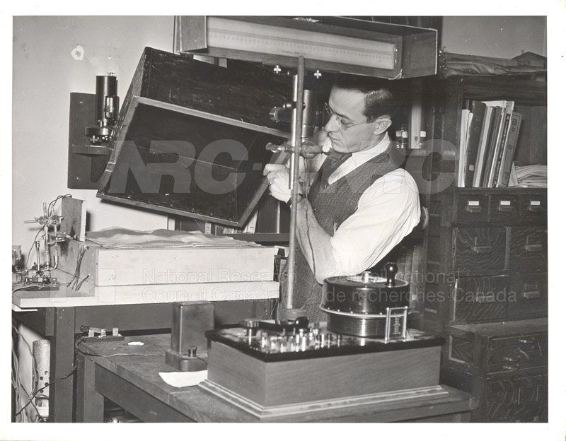 Mr. Tessier with Apparatus for Measuring Heat Transmission of Fabrics c.1940