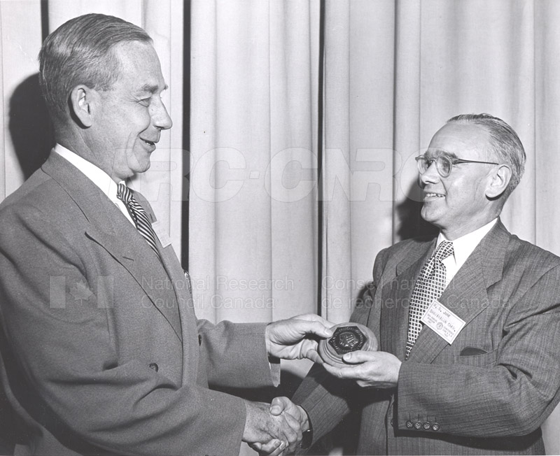 E.W.R. Steacie accepting CIC Award from R.S. Jane at CIC Conference 1953
