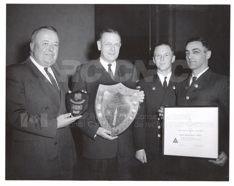 Presentation of Awards for Fire Prevention Contest Winner NRC, Dr. Steacie, J. Elliott 1961, 1962 005